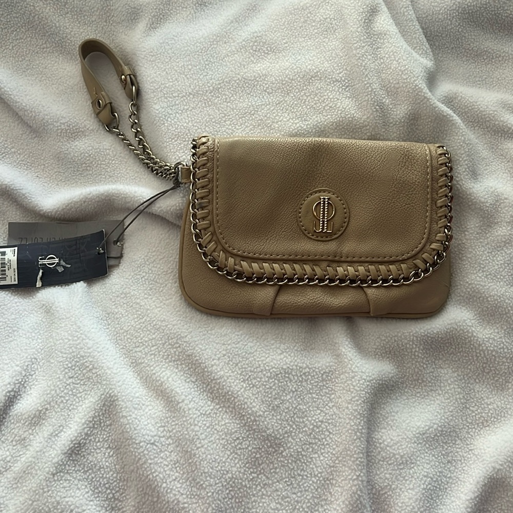 Tan mini bag from the outside and brown inside